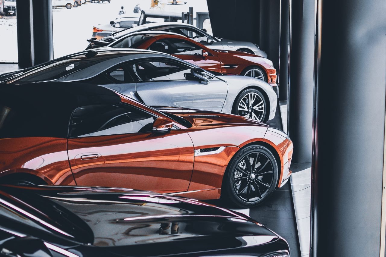 A row of cars lined up ready to be listed on a car-sharing marketplace