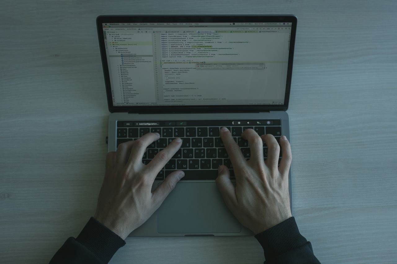 Developer reviewing security settings and code on a dark monitor screen