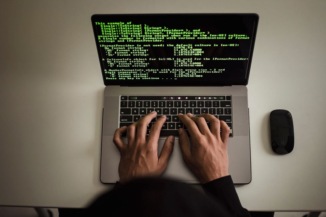 Padlock resting on a laptop keyboard representing website security